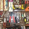 assorted tools, swiss card, scissors, nailclippers, pocket knives,