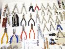 assorted leathermans, assorted pliers,