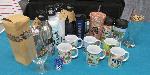 Assorted mug cups, tumblers and bottles.